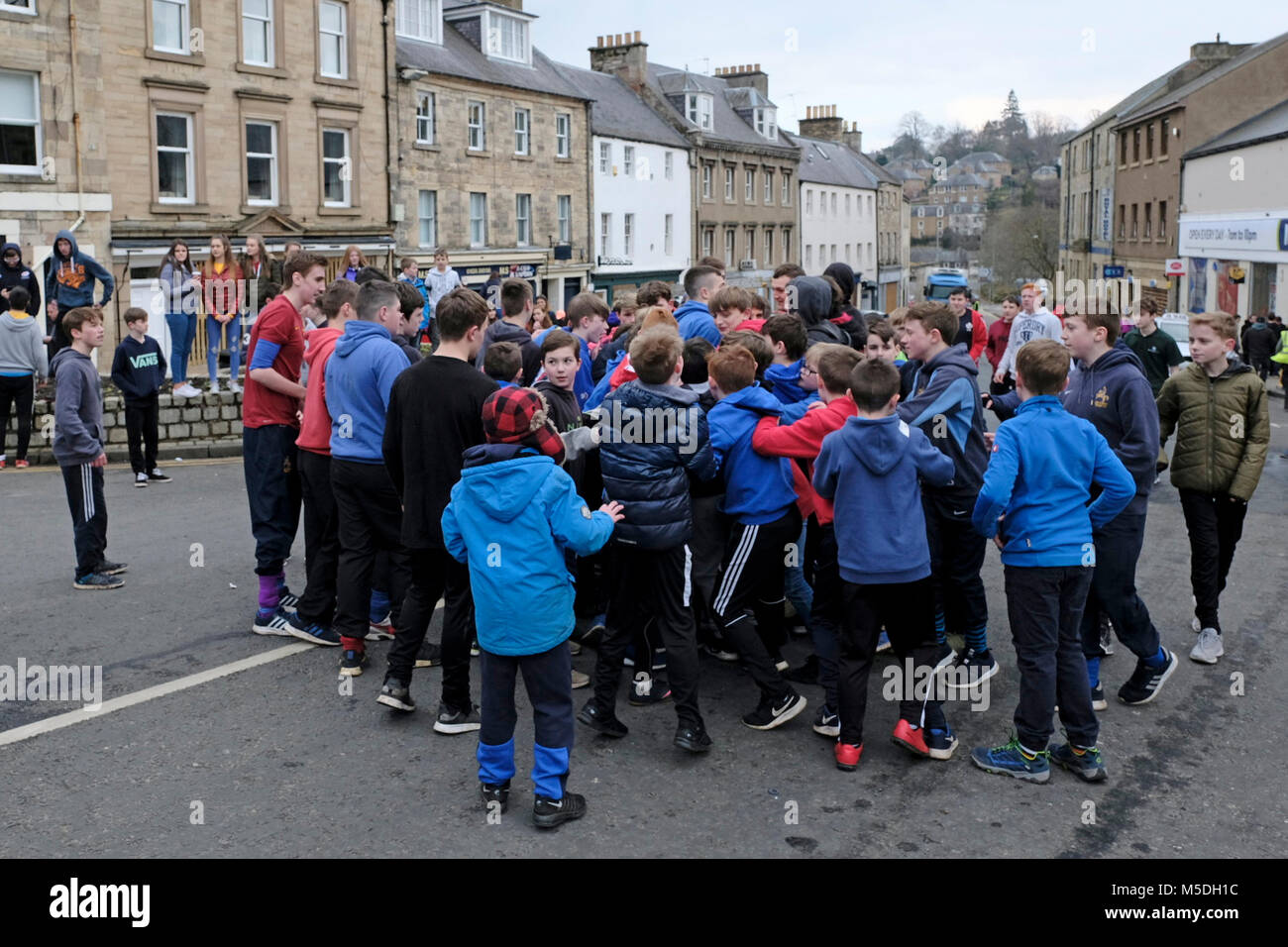 Jedburgh, Mercat Cross, UK. 22nd Feb, 2018. Jed Hand Ba' The annual game of hand ba' takes place every year the Thursday after Fastern's E'en. The tradition derives from 1548 when a party of Scots recaptured Ferniehirst Castle, a mile south of Jedburgh and used an Englishman's head in a celebratory game after the battle. ( Credit: Rob Gray/Alamy Live News Stock Photo