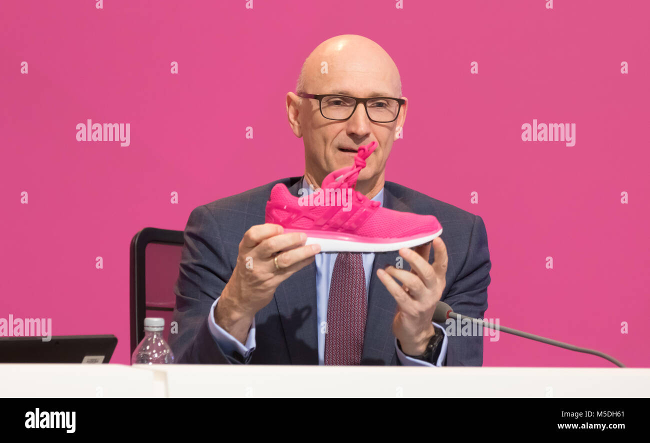 Bonn, Germany. 22nd Feb, 2018. Deutsche Telekom annual news conference: CEO Tim Hoettges displays a magenta sports shoe. Credit: Juergen Schwarz/Alamy Live News Stock Photo