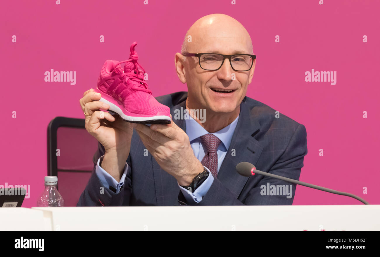 Bonn, Germany. 22nd Feb, 2018. Deutsche Telekom annual news conference: CEO  Tim Hoettges displays a magenta sports shoe. Credit: Juergen Schwarz/Alamy  Live News Stock Photo - Alamy