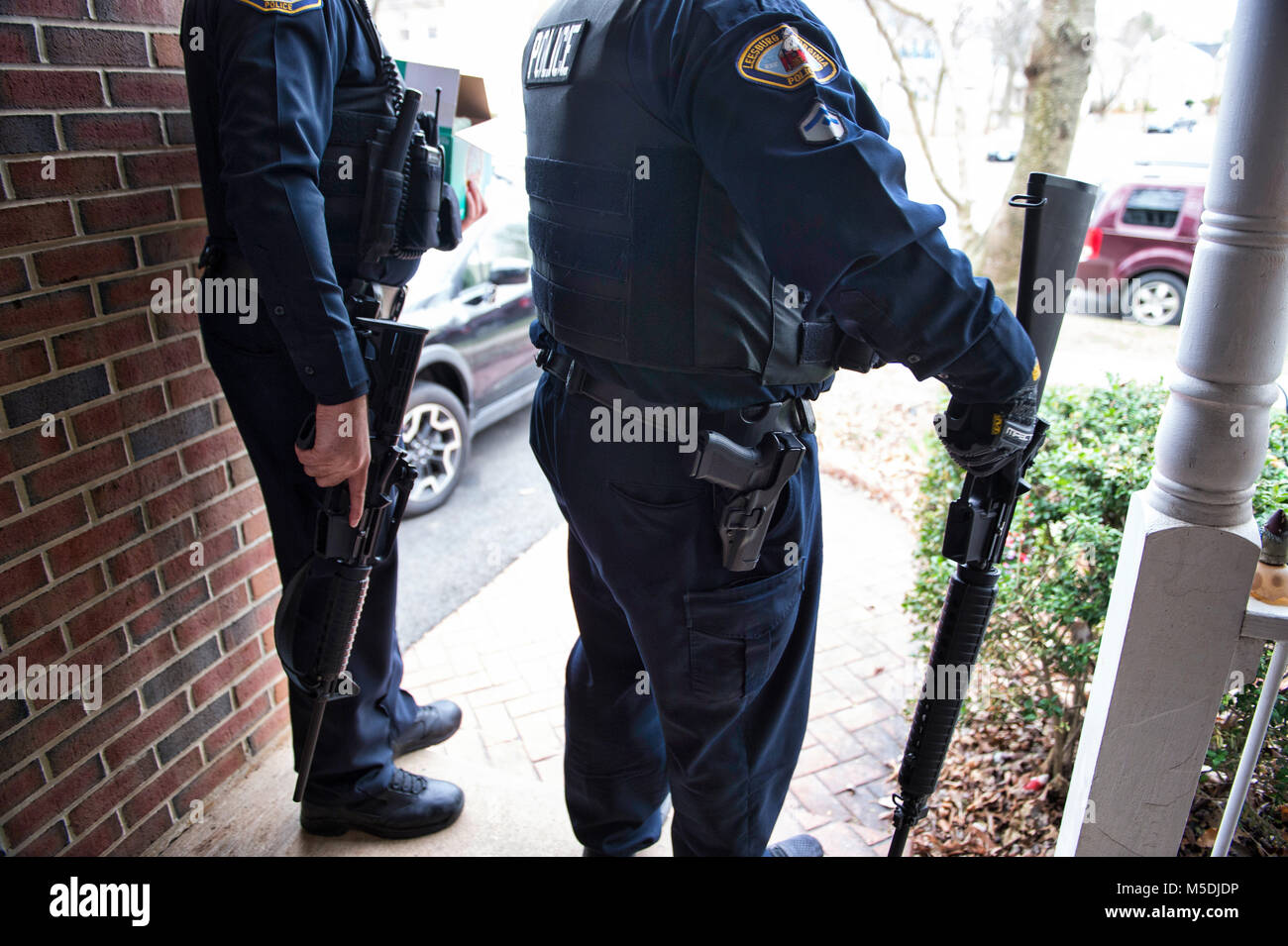Leesburg, Virginia, USA. 22nd Feb, 2018. A Leesburg veteran surrendered two AR-15's today to the Leesburg Police Department. Here LPD officers removed the guns from the home, two AR-15's with about 3000 rounds of ammunition, 2 dozen high capacity magazines and other assault rifle accessories. They will be destroyed and not put back into circulation. Credit: William Graham/Alamy Live News Stock Photo
