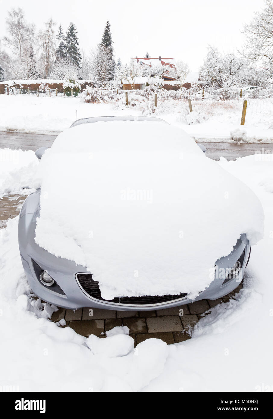 Snowed car on a parking lot Stock Photo