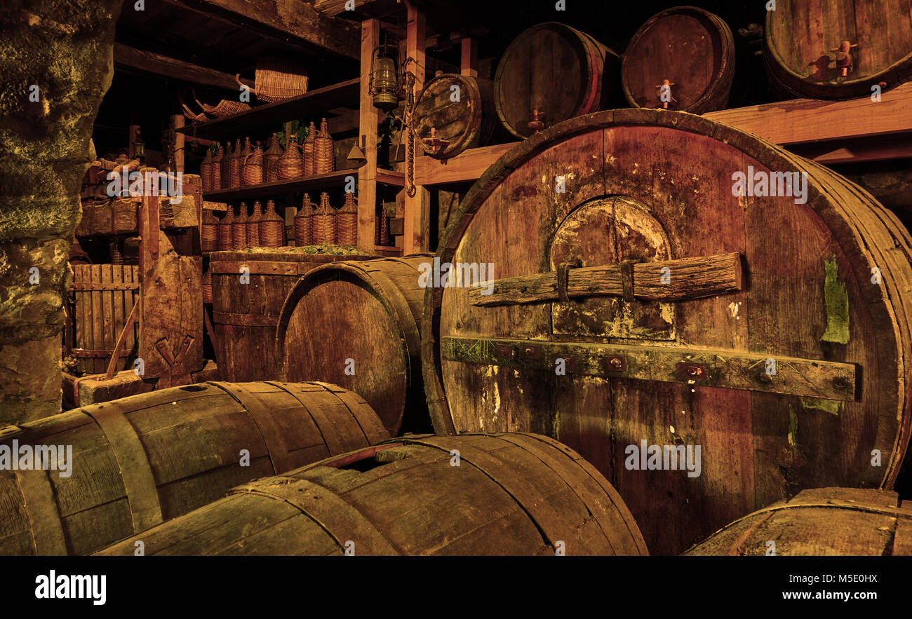 Wine barrels and casks in old cellar Stock Photo
