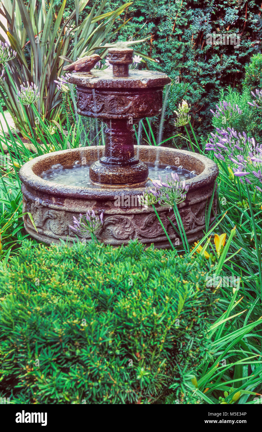 Fountain in garden setting Stock Photo