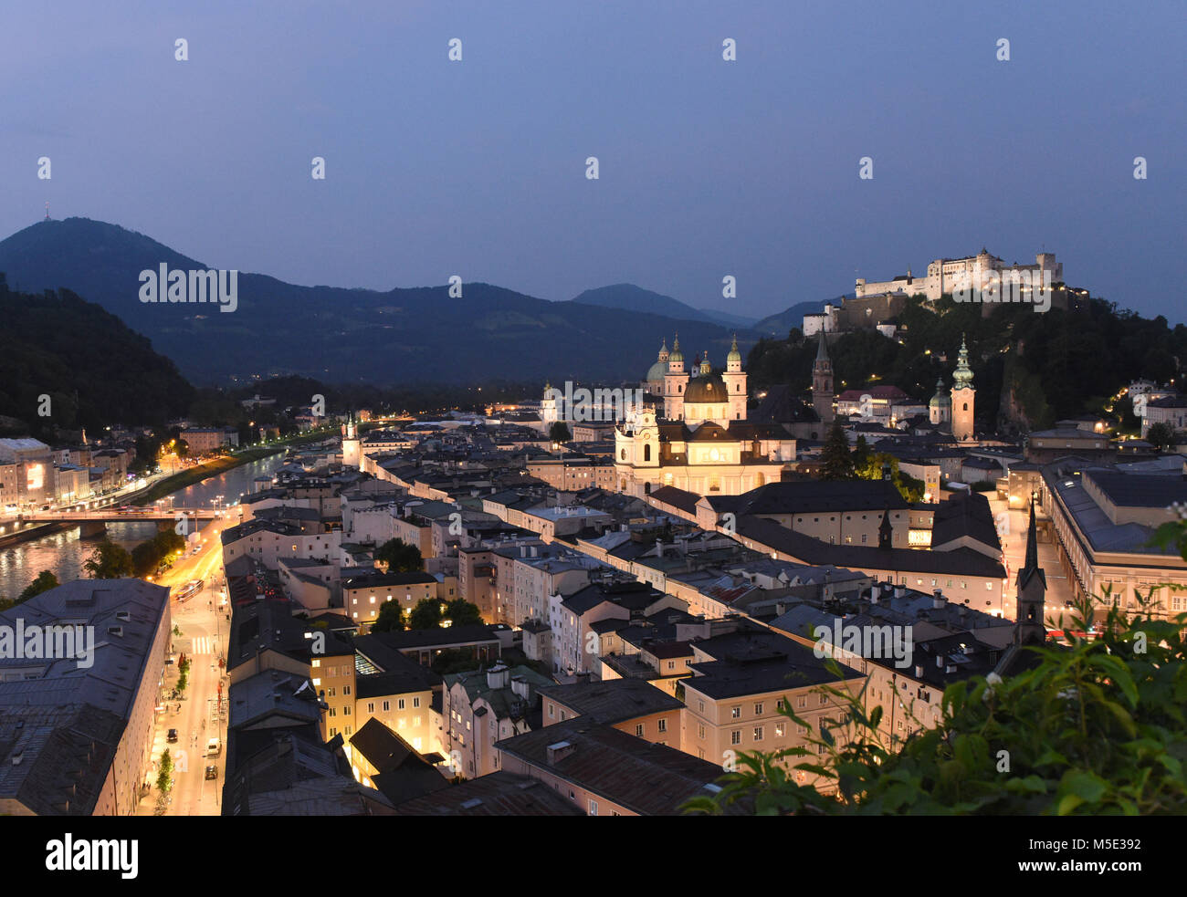 Salzburg cityscape at night with fortress Hohensalzburg, Austria Stock Photo