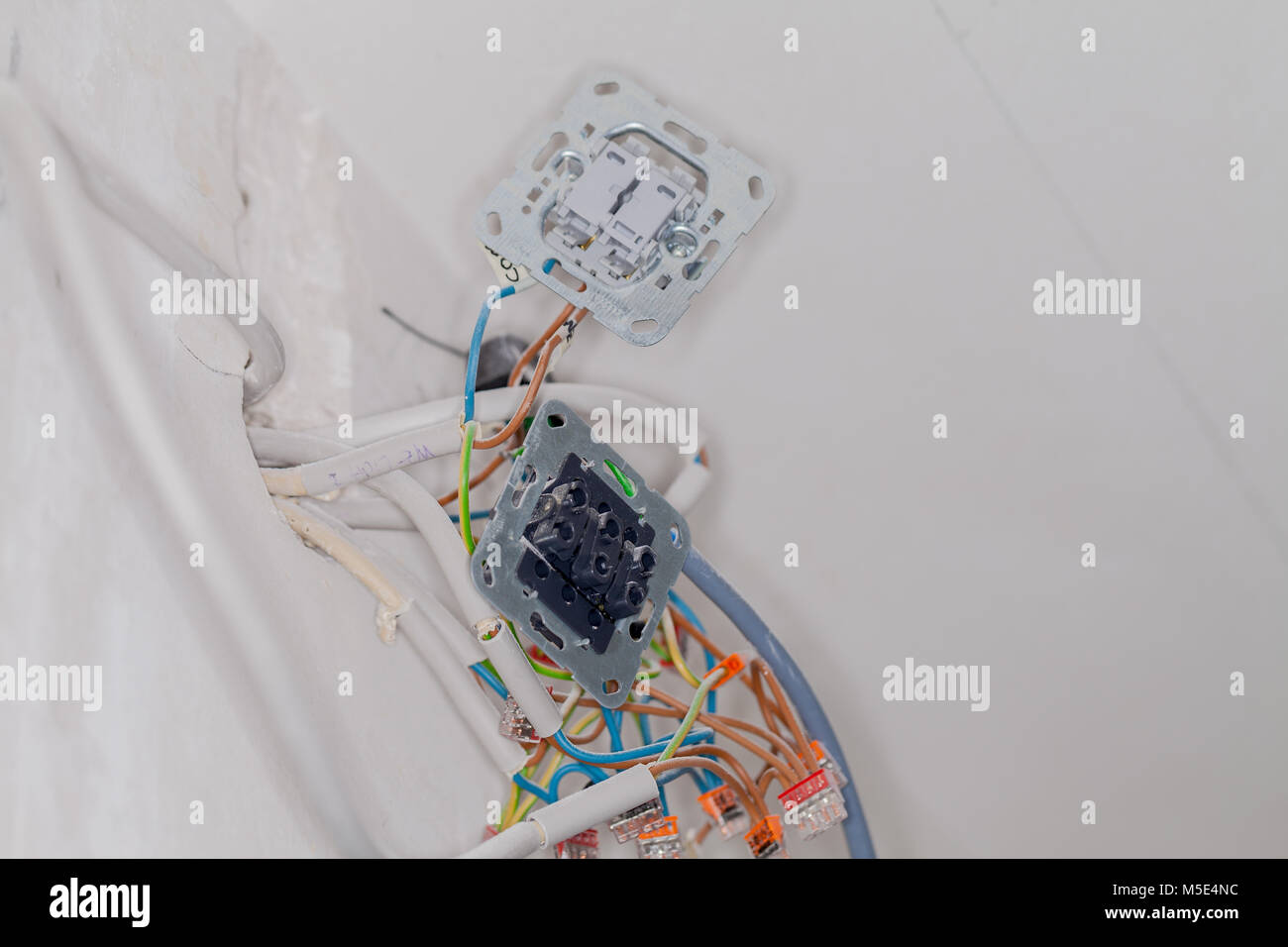 an open wall socket on construction site Stock Photo - Alamy