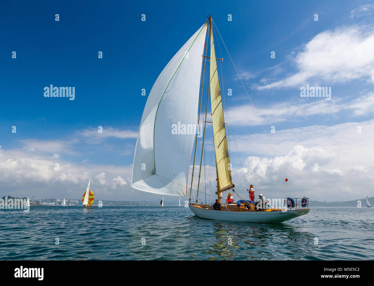 The classic wooden yacht Sibyl Of Cumae flying her gennaker sail. Stock Photo