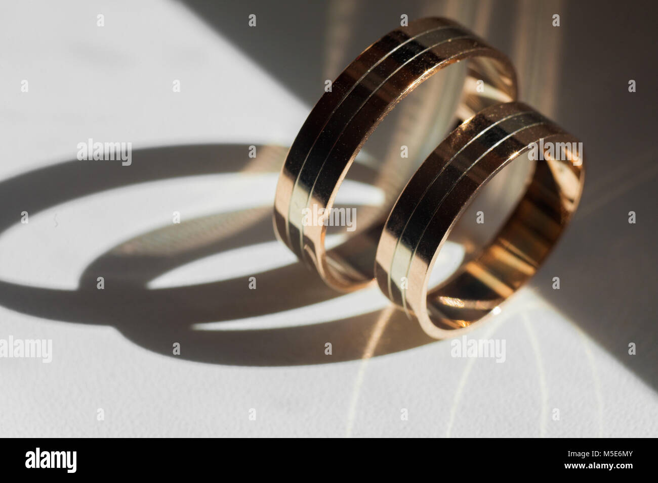 Golden wedding rings for bride and groom standing on the sides Stock ...