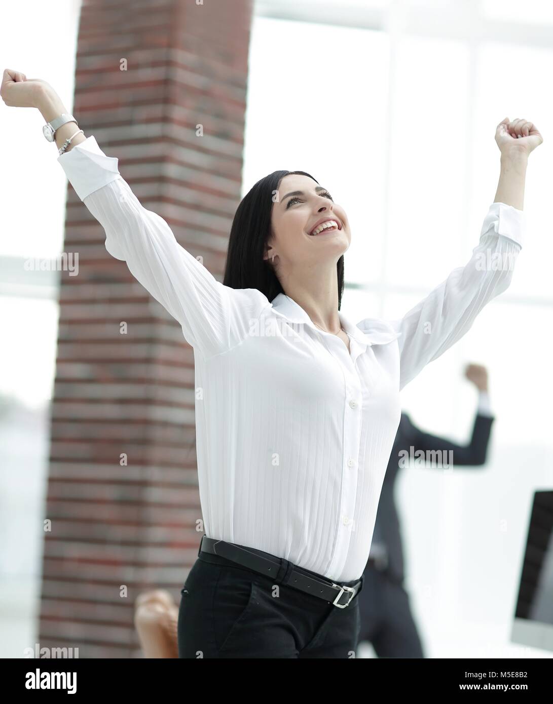 happy young business woman on a blurred office background Stock Photo ...