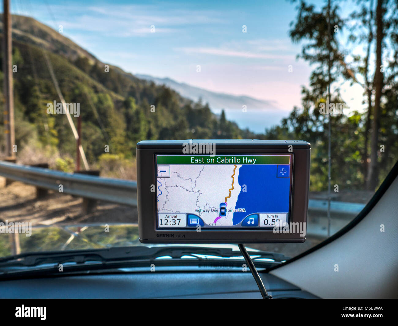 Satellite Navigation screen display of coastal CA Highway One at Cabrillo Highway Pacific Ocean behind Monterey Pacific Ocean California USA Stock Photo