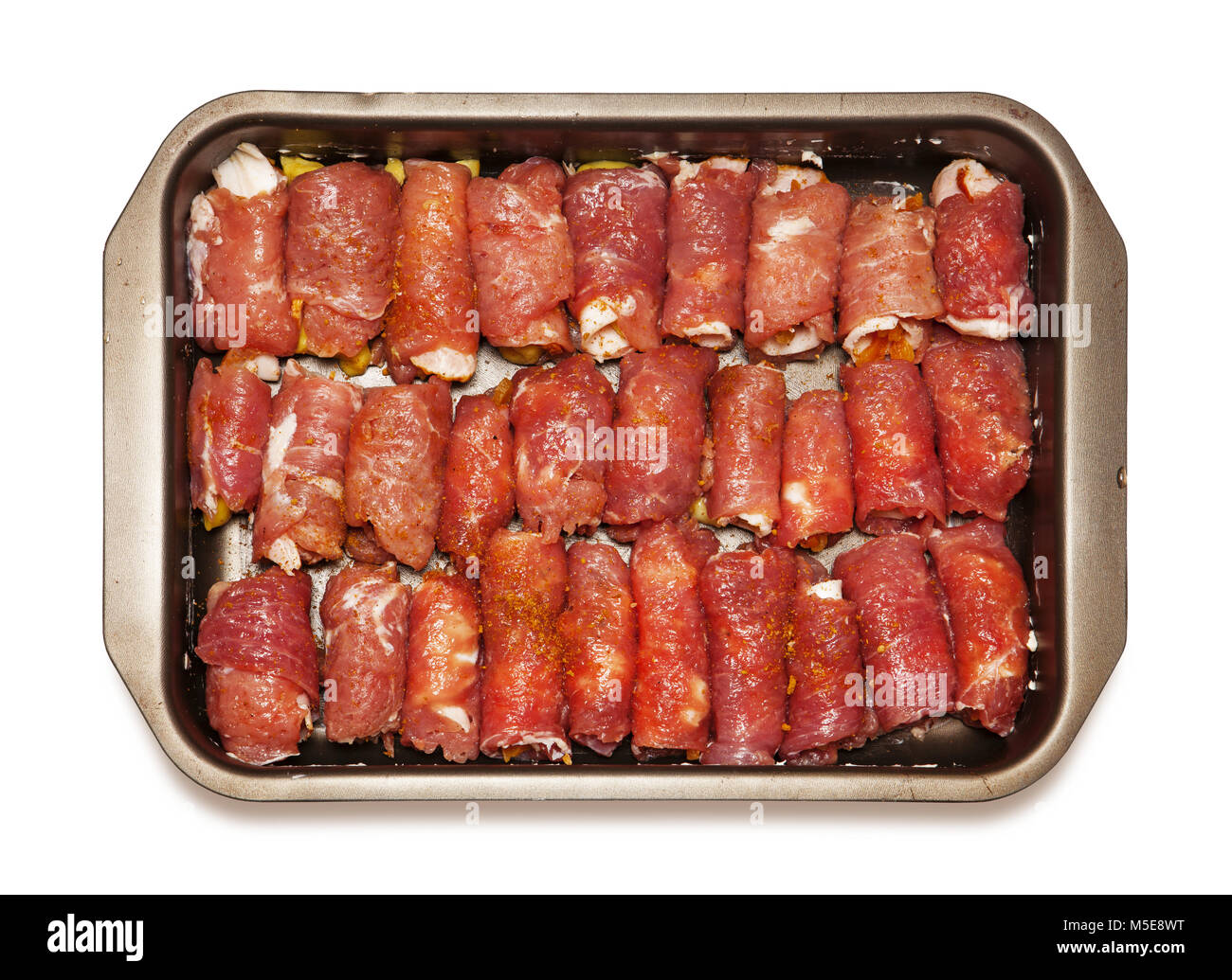 meat rolls from the chef on dripping pan, isolated on white Stock Photo