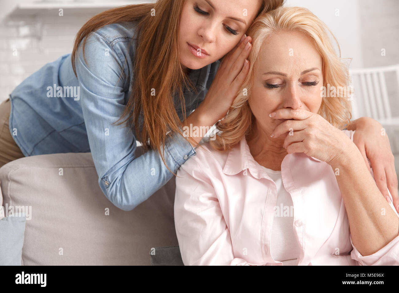 Mother and daughter together at home weekend support Stock Photo Alamy