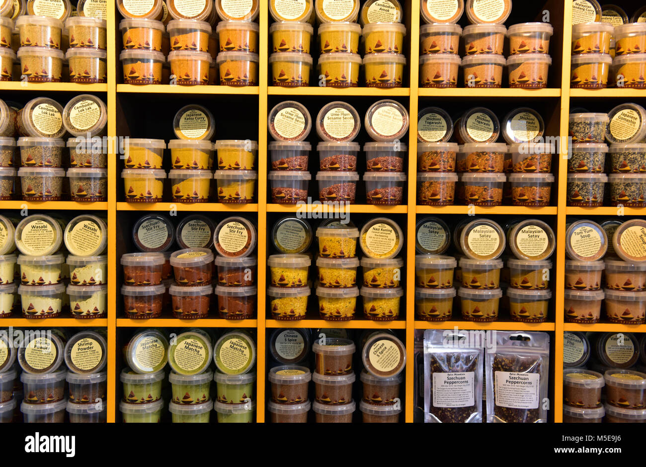 a spice store shelves full of a variety and choice of exotic herbs and spices at borough market