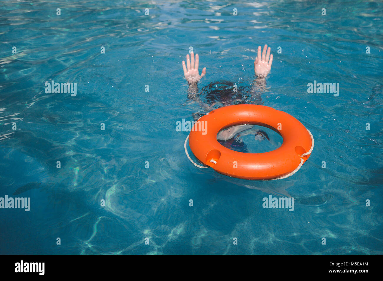 Help In The Water Female and lifebelt in water. Drowning help assistance concepts Stock ...
