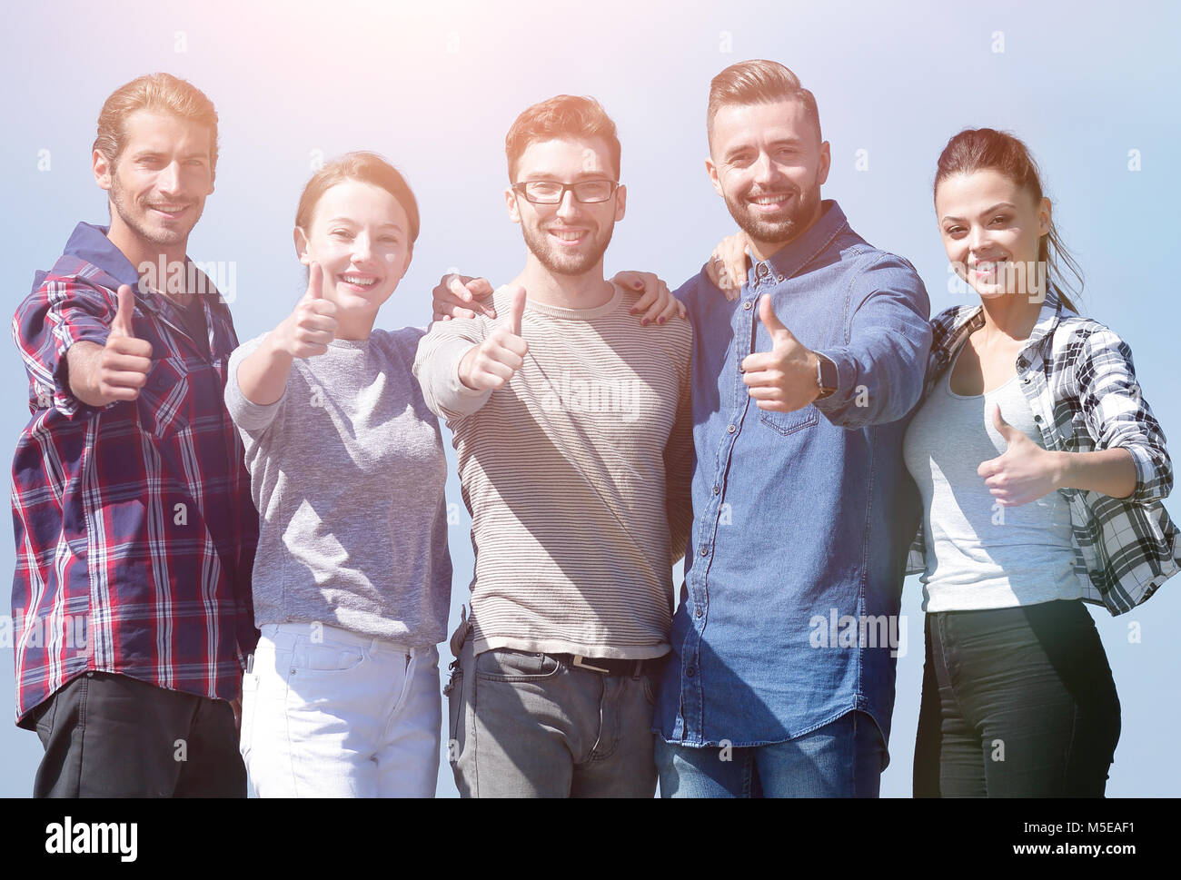 group of young people showing thumb up Stock Photo - Alamy