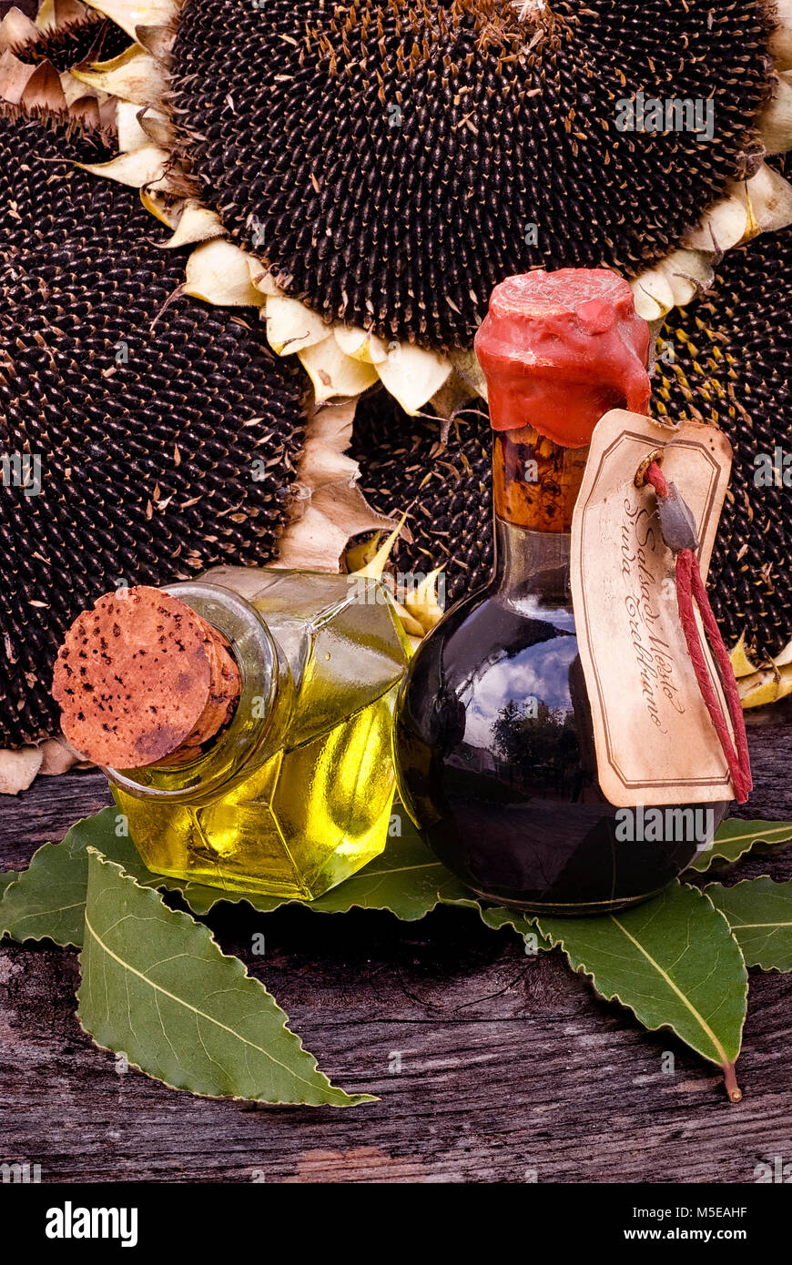 Traditional Balsamic Vinegar and pouring virgin olive oil with bay