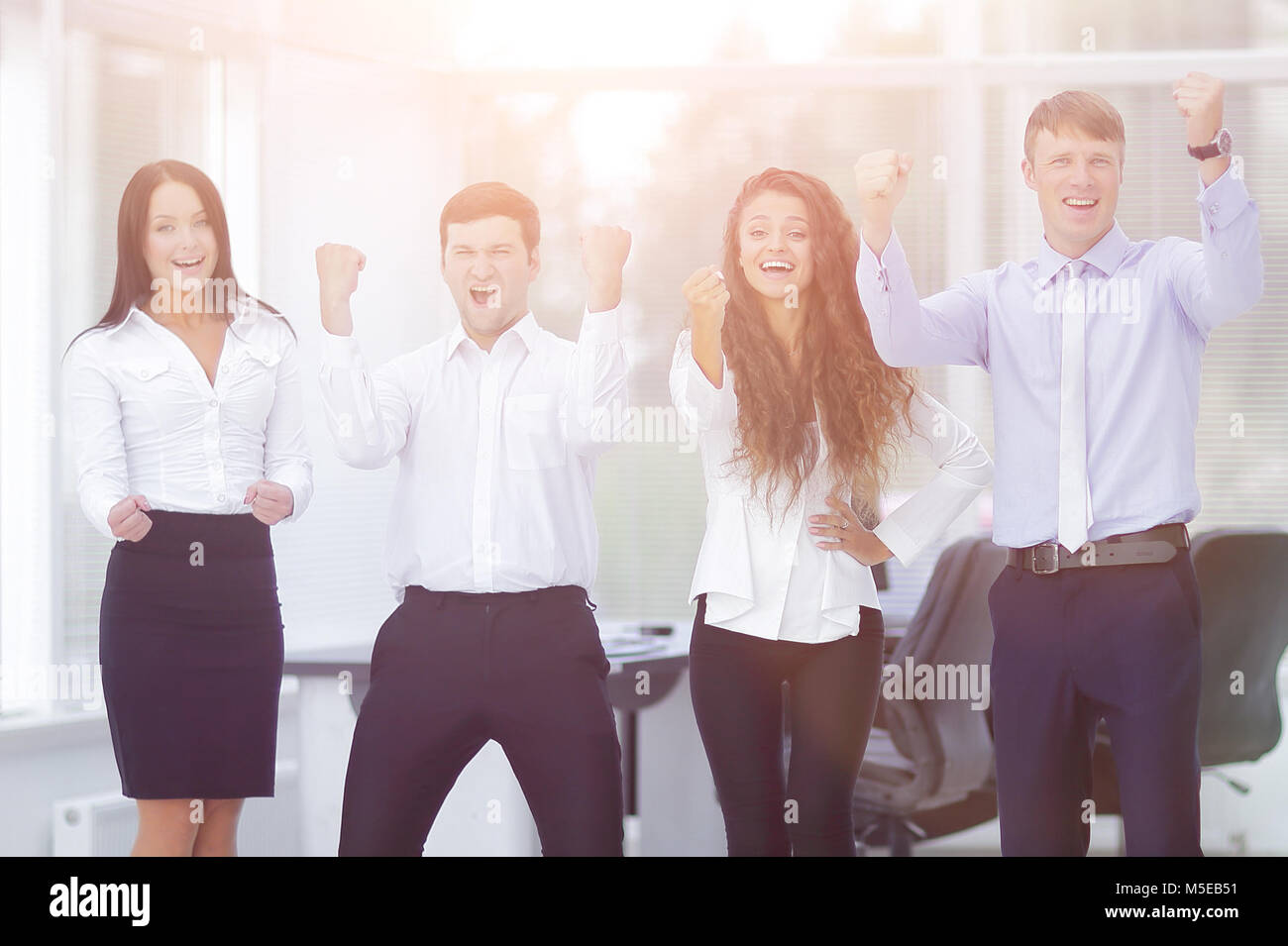 portrait of a triumphant business team Stock Photo - Alamy