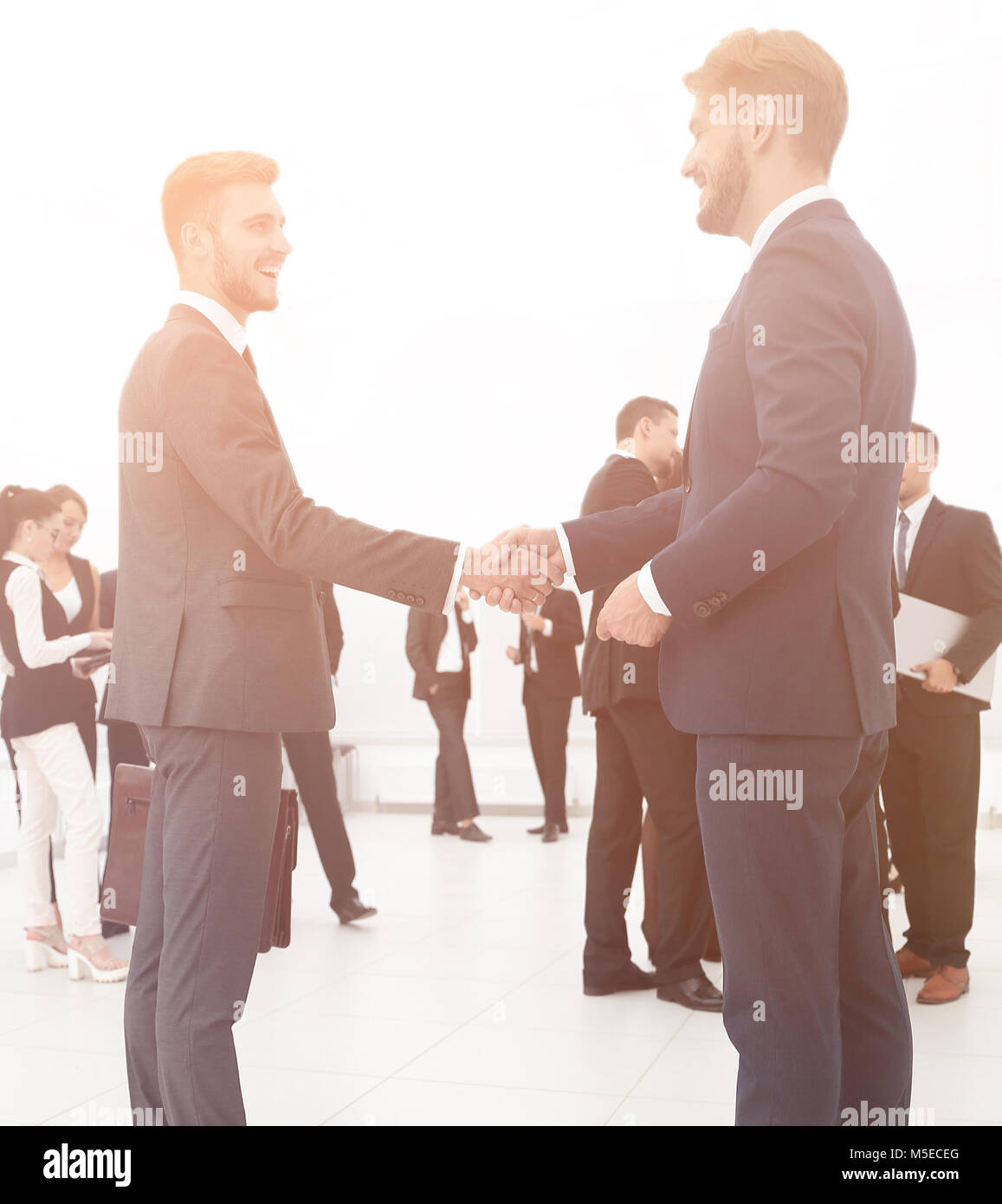 handshake of business partners on the background of business tea Stock ...