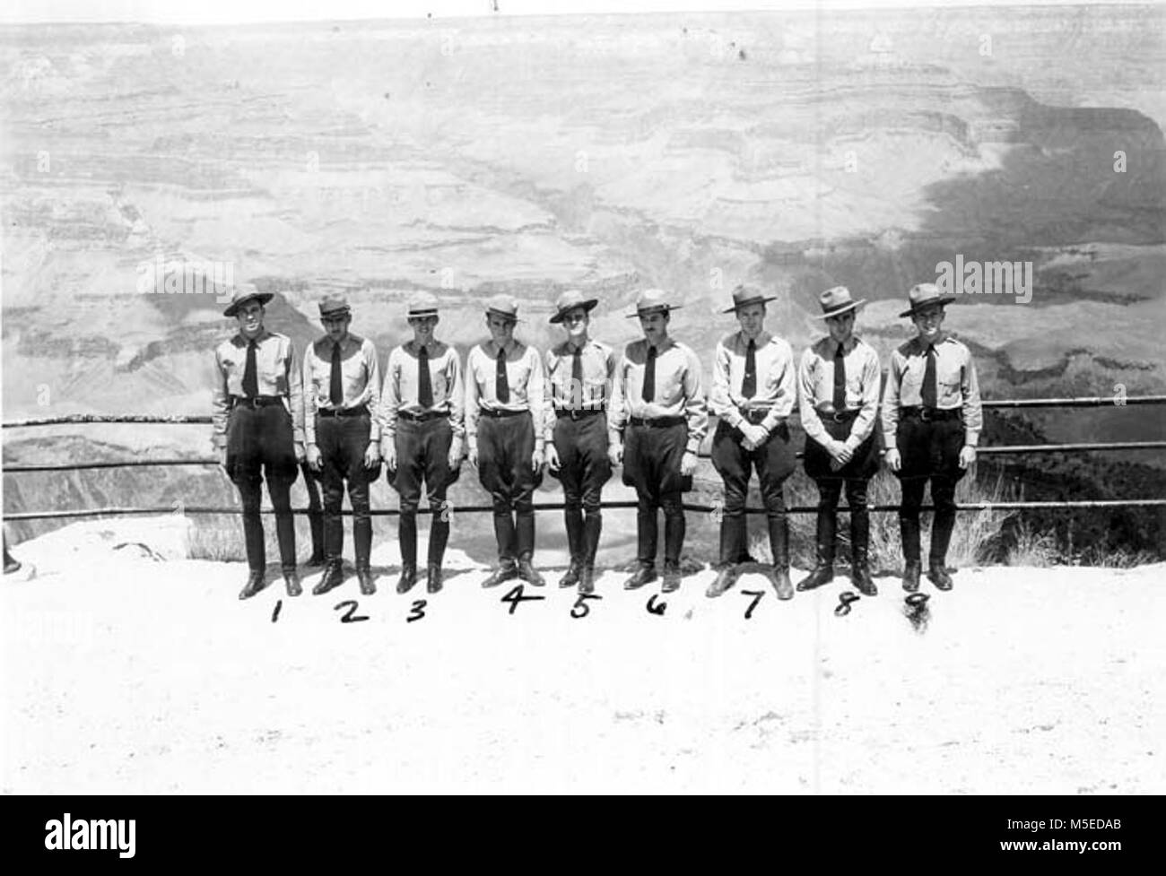 Grand Canyon Seasonal Rangers   GRAND CANYON NATIONAL PARK SEASONAL RANGERS AT HOPI POINT, SOUTH RIM OF GRAND CANYON.  LEFT TO RIGHT:  FRANK W. BARNETT, JOHNNY RICCA, JOHN CARLOCK, VIRGIL GIPSON, CHARLIE HIRST, CHIEF RANGER P.E. BROWN, RALPH WHITE, HAROLD BARRON, JOSEPH STEIN.  DATE 1940. Stock Photo