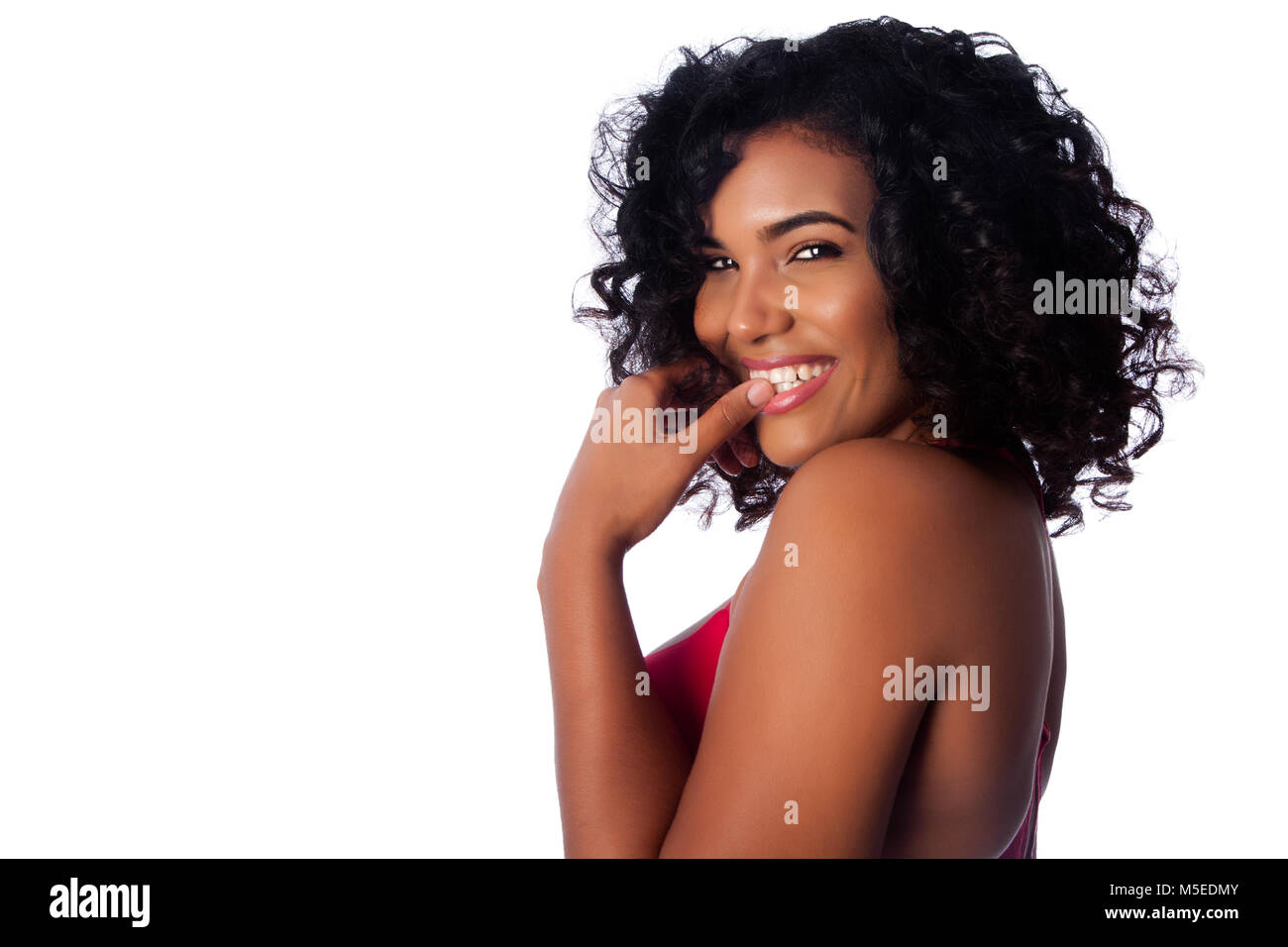 Beautiful face of smiling woman with curly hair on white. Stock Photo