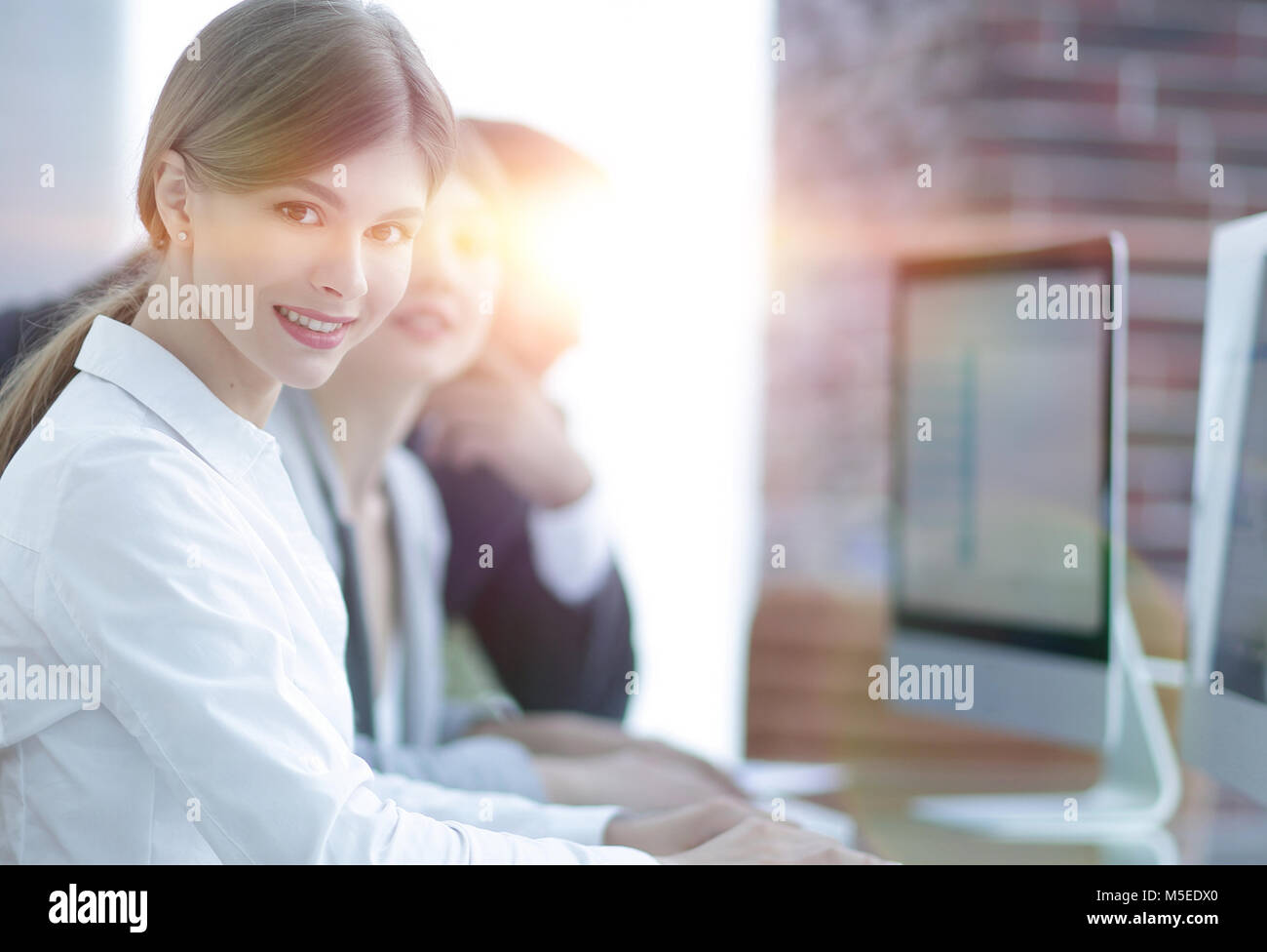employees working on personal computers with financial data Stock Photo ...