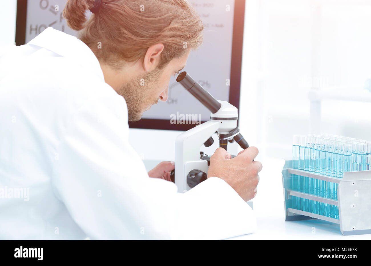 senior lab technician using microscope in laboratory Stock Photo Alamy