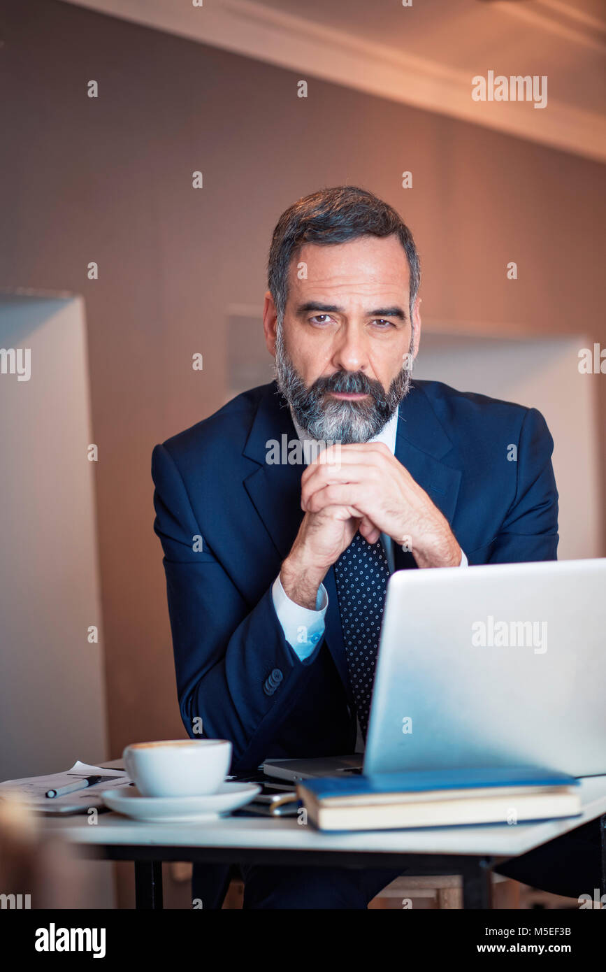 Successful senior mature business man portrait in a coffee shop Stock Photo