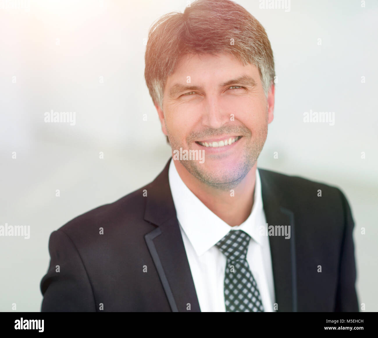 Portrait of a smiling successful businessman Stock Photo - Alamy
