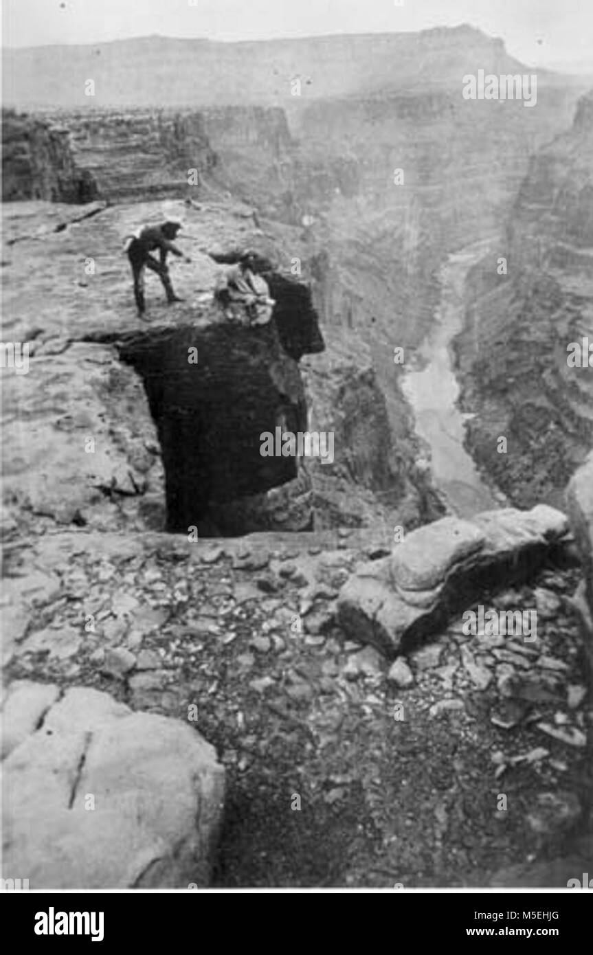 Grand Canyon Powell Expedition   TWO MEN OVERLOOKING CANYON.  POWELL'S SECOND EXPEDITON, NEAR TOROWEAP (OR MUAV), LOOKING EAST. (TUWEEP) Stock Photo