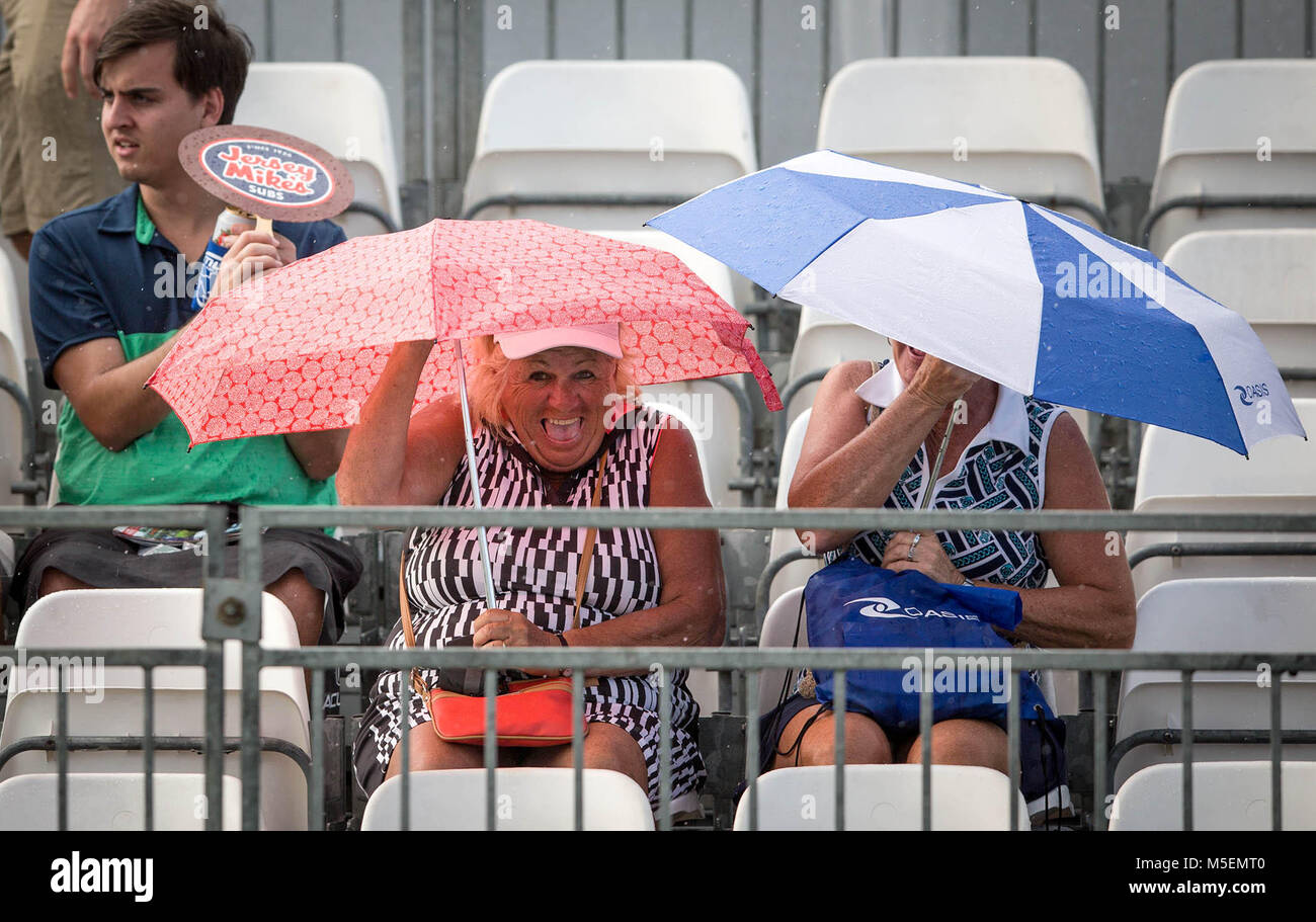 Palm Beach Gardens, Florida, USA. 22nd Feb, 2018. Fans take cover during a brief rain shower during the first round of the Honda Classic at PGA National Resort and Spa in Palm Beach Gardens, Florida on February 22, 2018. Credit: Allen Eyestone/The Palm Beach Post/ZUMA Wire/Alamy Live News Stock Photo