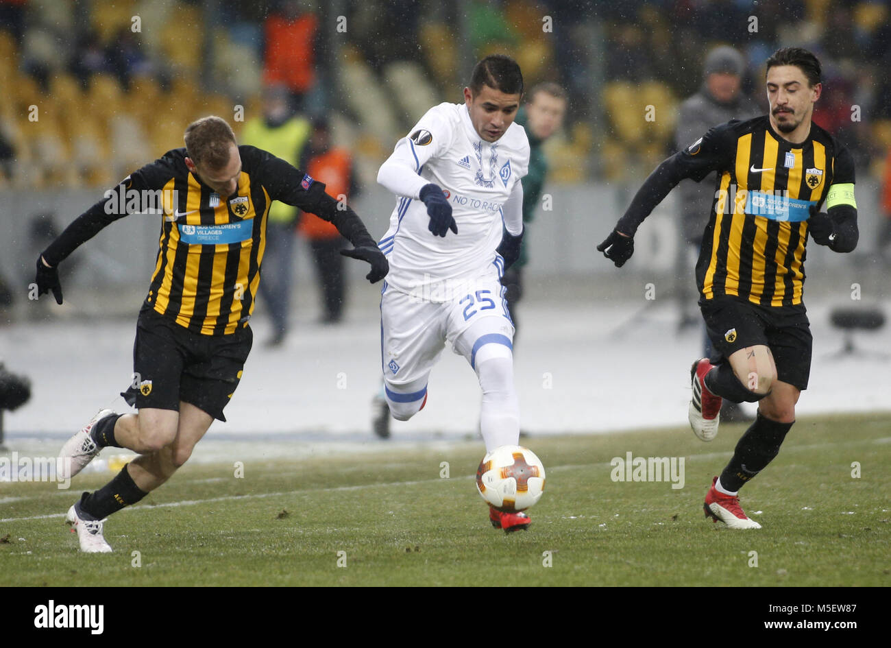February 22, 2018 - Dynamo Kyiv's Derlis GonzÃ¡lez (C) fights for the ball  with AEK Athens Michalis Bakakis(L) and Andre Simoes (R ) during the Round  32 second leg UEFA Europa League