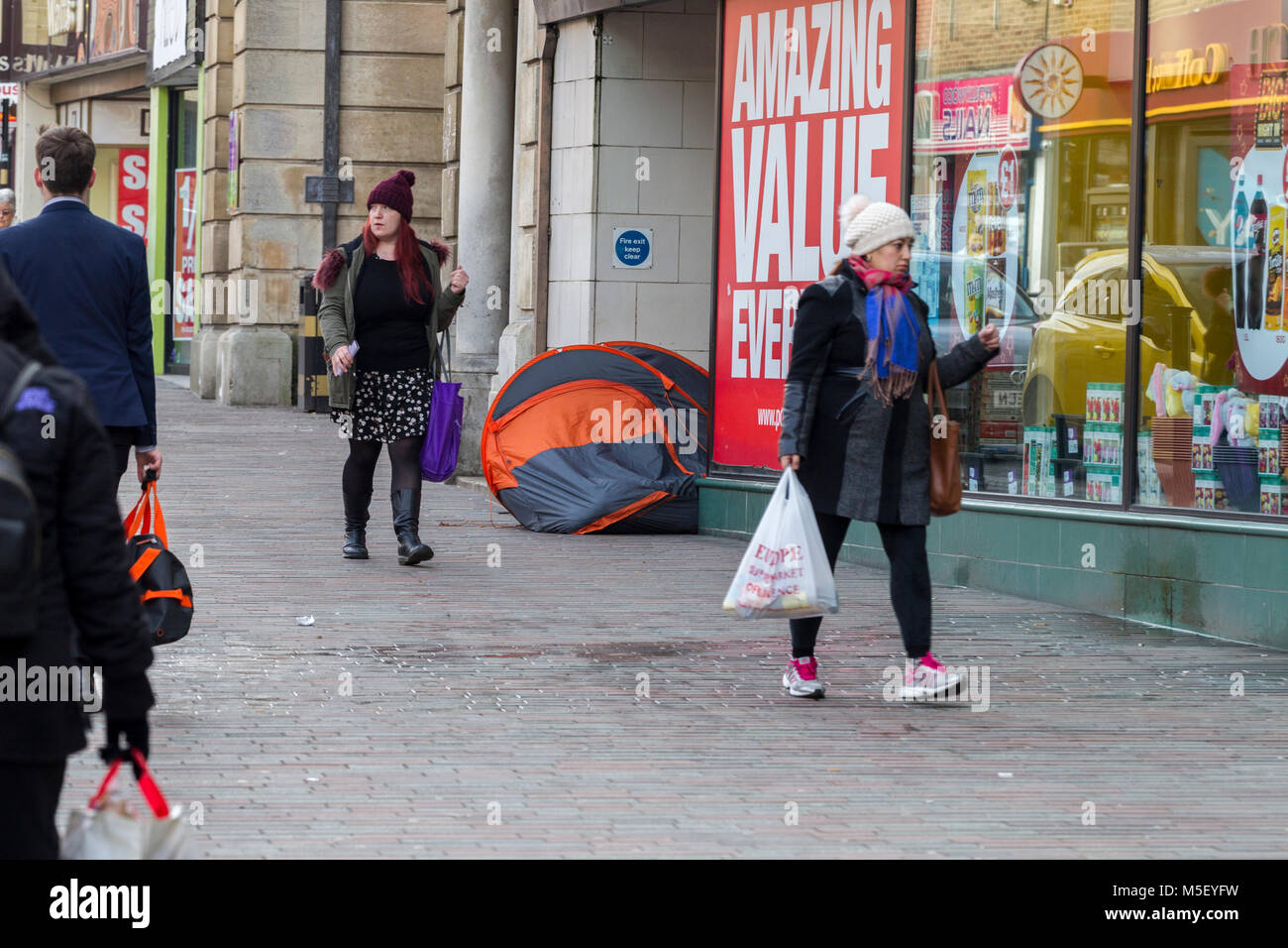 Northampton, U.K. 23rd February 2018. Weather. Homeless living in a tent in a shop doorway in Abinging street on a biitterly cold morning with temperature -1% . Credit: Keith J Smith./Alamy Live News Stock Photo