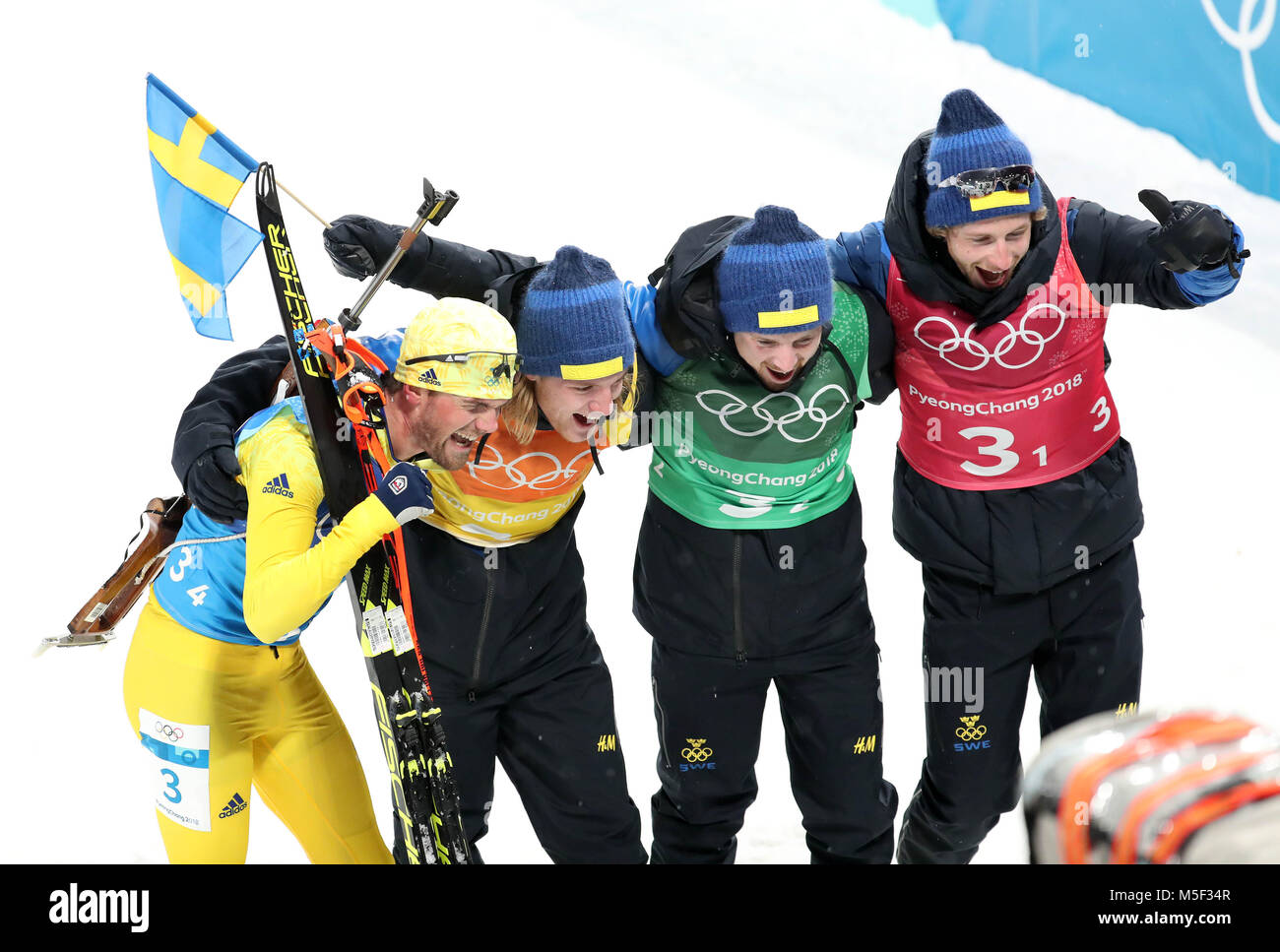 Pyeongchang, South Korea. 23rd Feb, 2018. Peppe Femling, Jesper Nelin, Sebastian Samuelsson and Fredrik Lindstroem (R to L) of team Sweden pose for photos after finishing men's 4x7.5km relay of biathlon at the 2018 PyeongChang Winter Olympic Games at Alpensia Biathlon Centre, PyeongChang, South Korea, Feb. 23, 2018. Team Sweden claimed champion in a time of 1:15:16.5. Credit: Li Gang/Xinhua/Alamy Live News Stock Photo