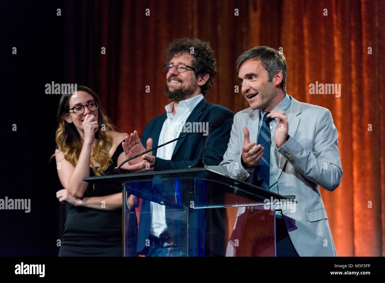 Eric Kaplan, Steve Holland and Tara Hernandez at the Humanitas awards Stock Photo