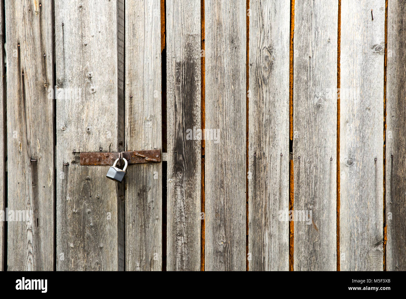 old lock on wood door Stock Photo - Alamy