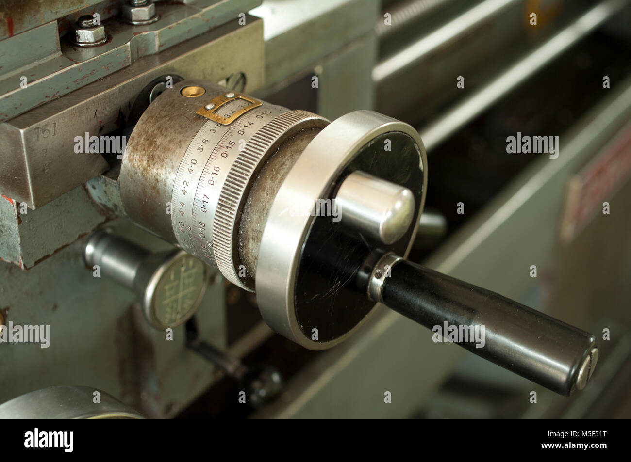 Cross feed handwheel on a lathe machine cross slide Stock Photo