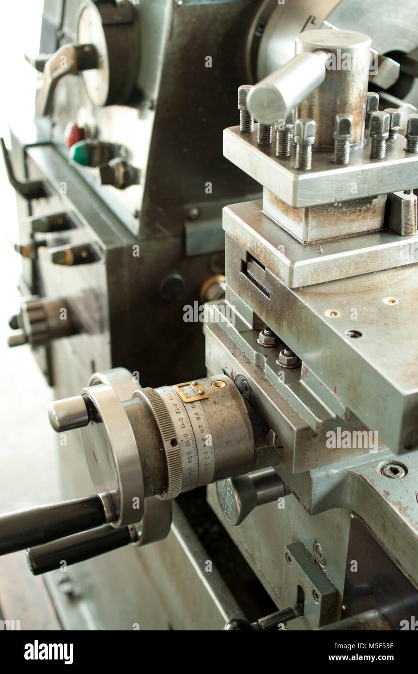 Lathe machine cross slide with handwheel and tool post, vertical orientation Stock Photo