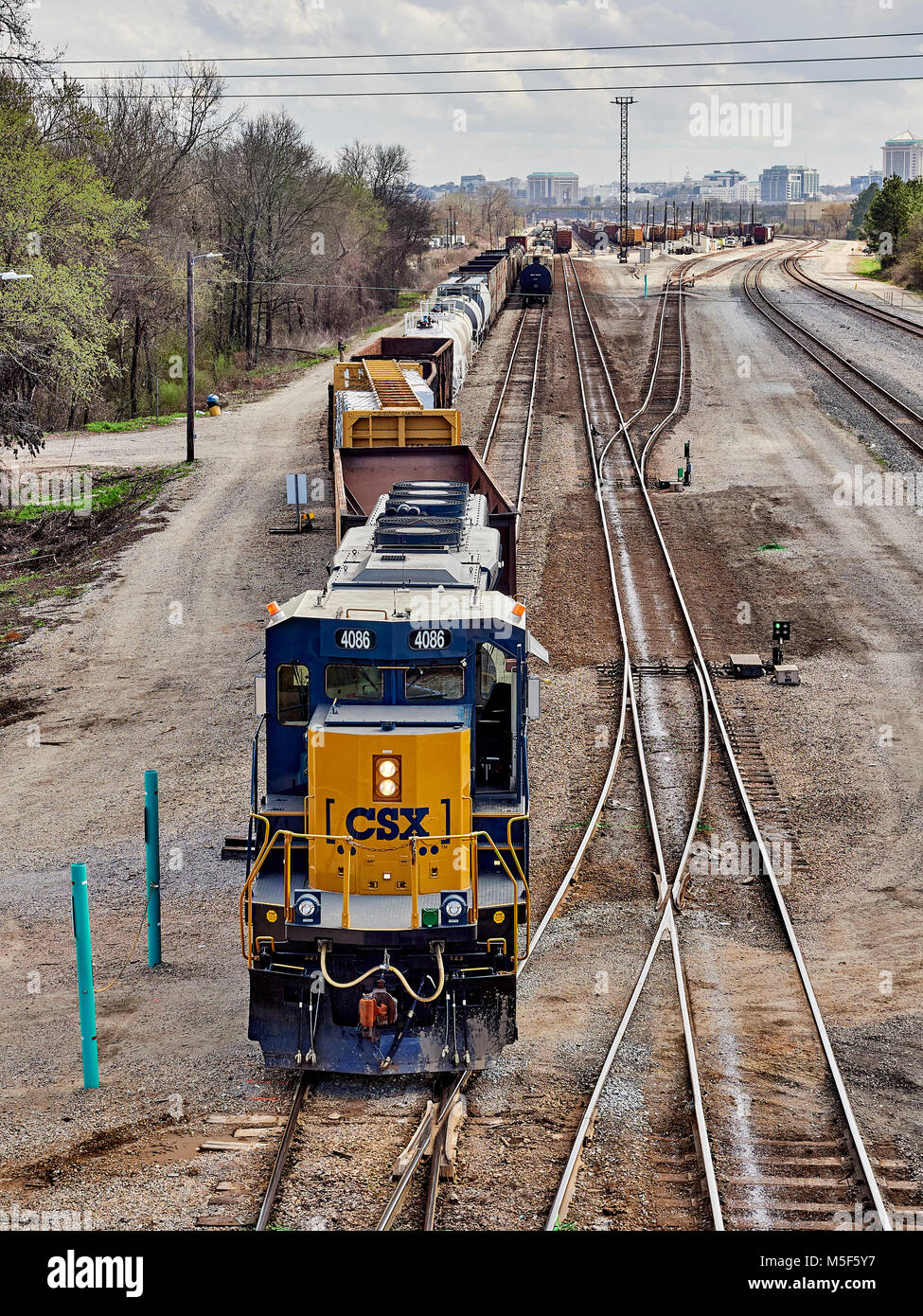 CSX Corporation locomotive engine 4086 moving freight or rail cars in the switching yard of CSX Transportation in Montgomery Alabama, USA. Stock Photo