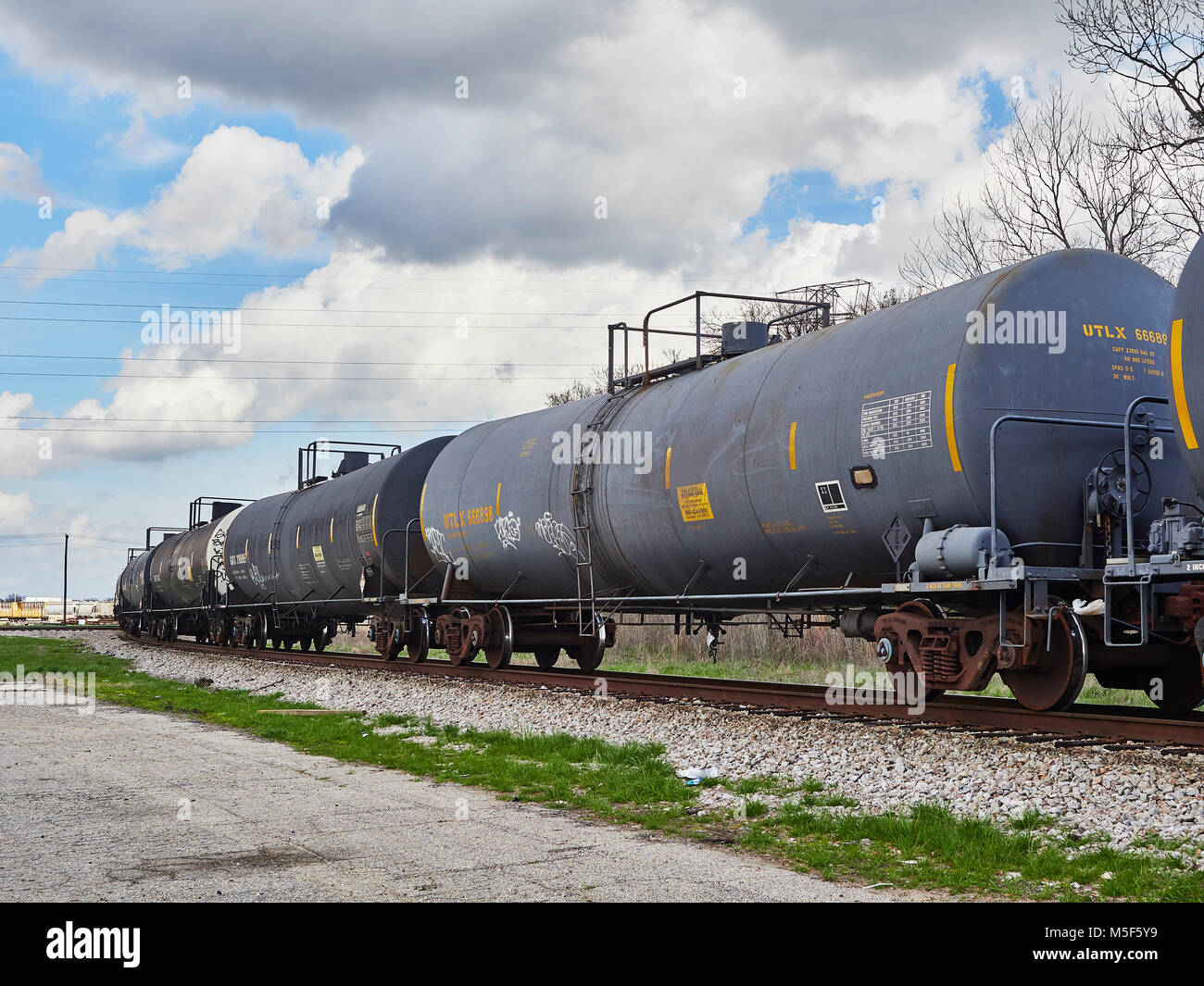 Railroad or train tank cars waiting on a siding in the Montgomery Alabama, USA, CSX switching yard. Stock Photo