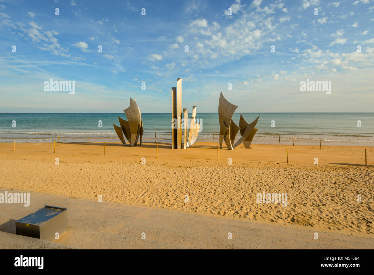 The WW2 American D-Day landing Omaha Beach monument Les Braves Memorial on the sandy beach at Saint-Laurent-sur-Mer at Normandy, France Stock Photo