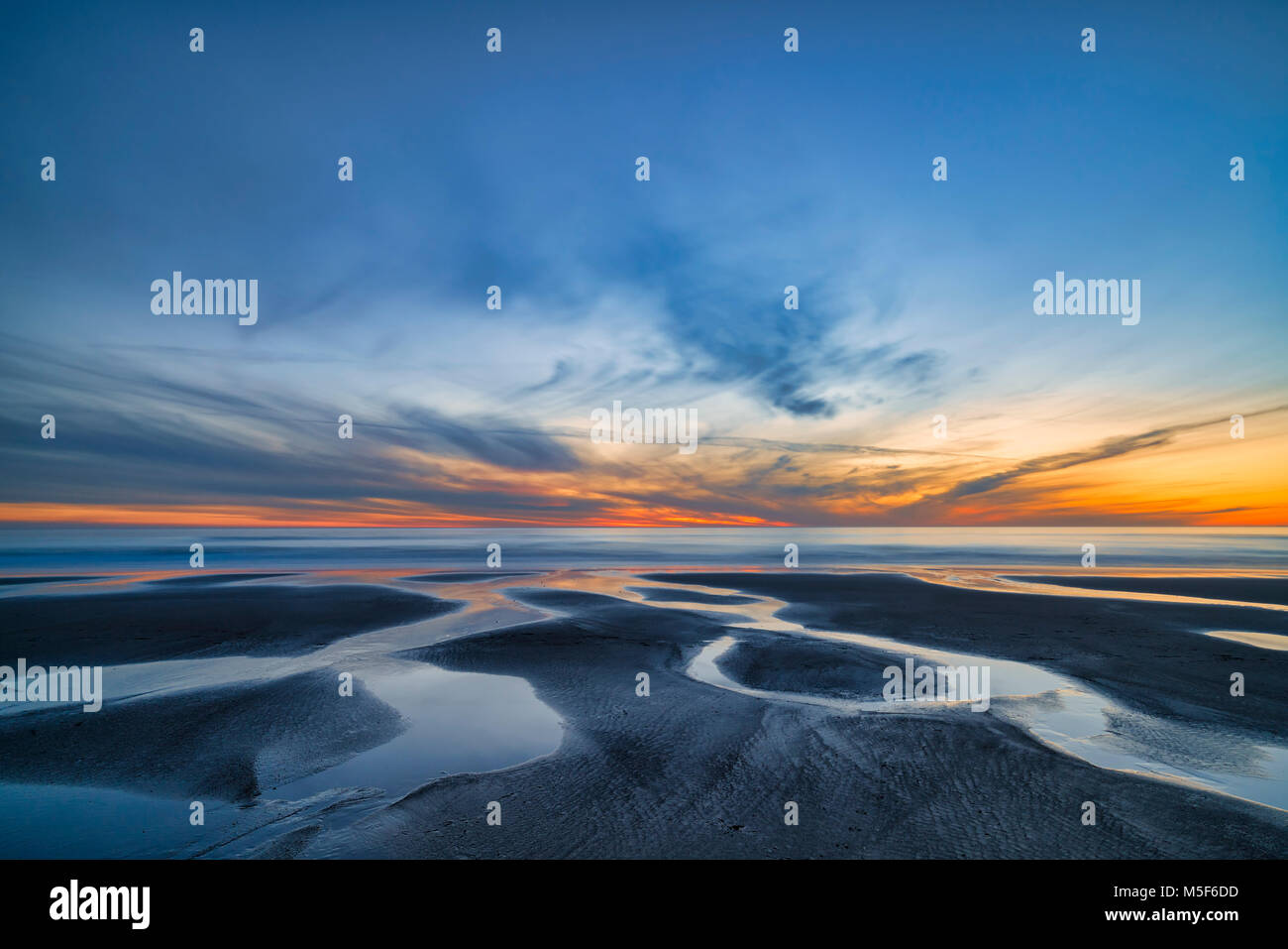 Streams running into the ocean Stock Photo