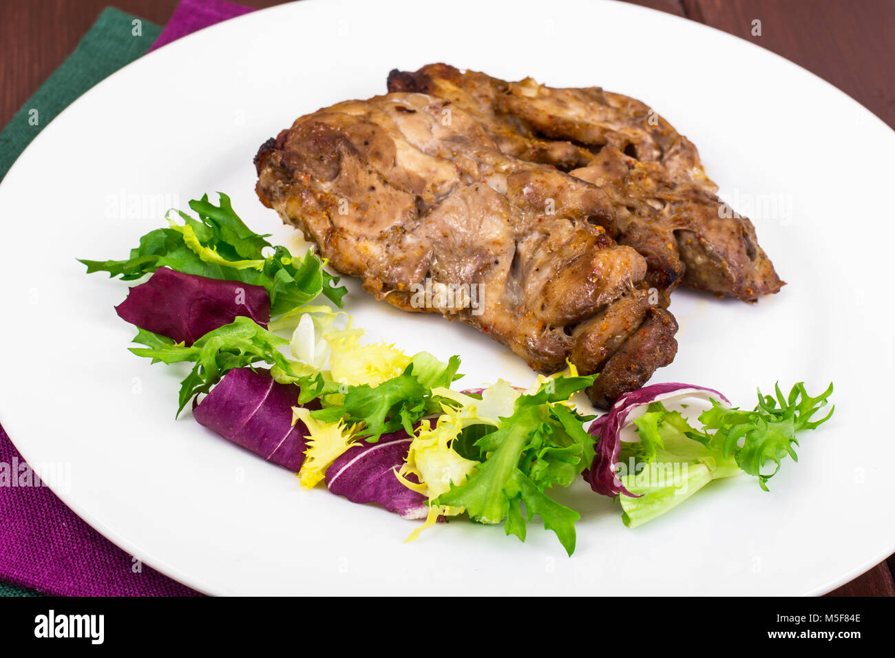 Concept of proteincarbohydrate nutrition. Chicken meat with lettuce