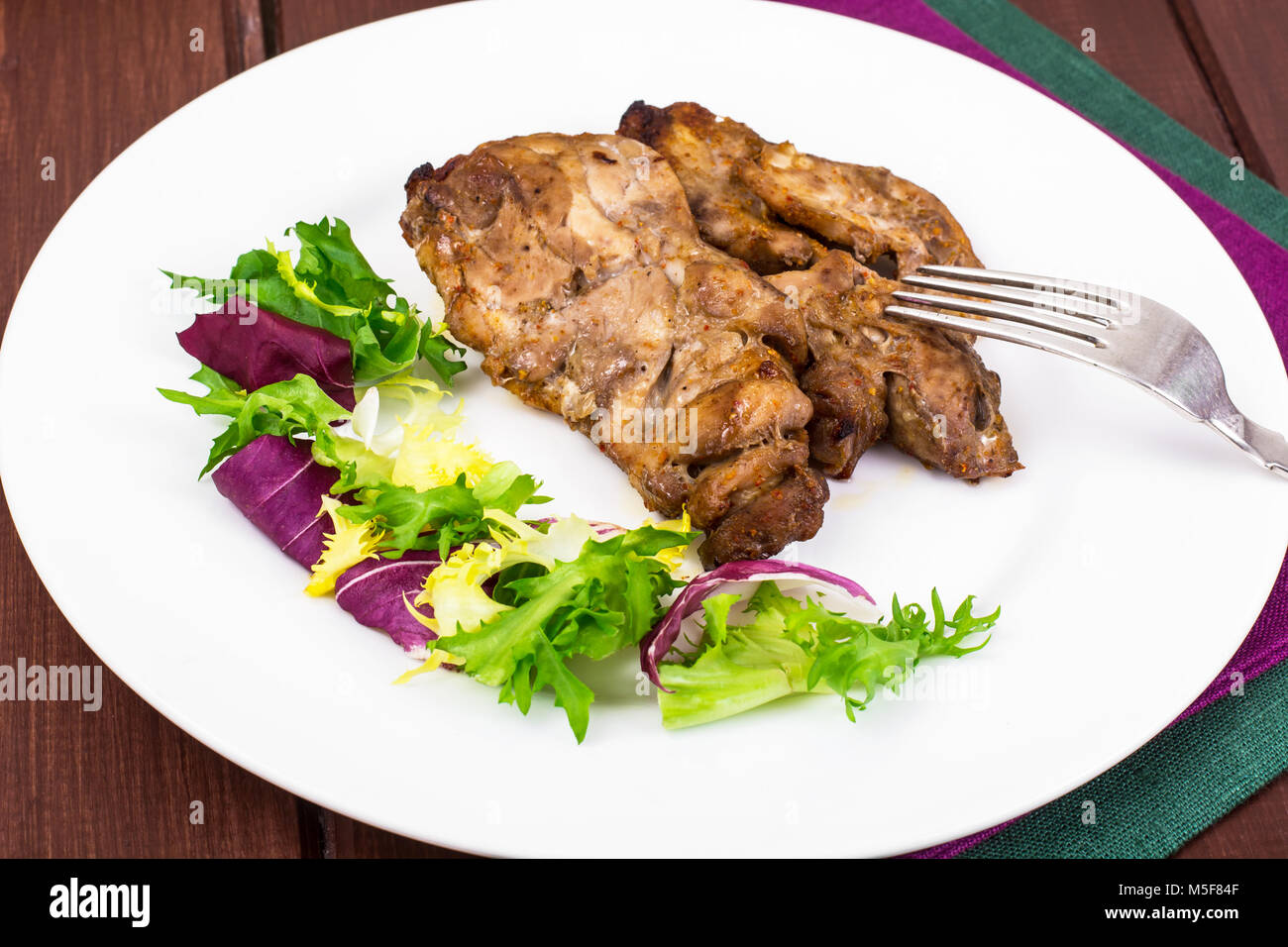 Concept of proteincarbohydrate nutrition. Chicken meat with lettuce