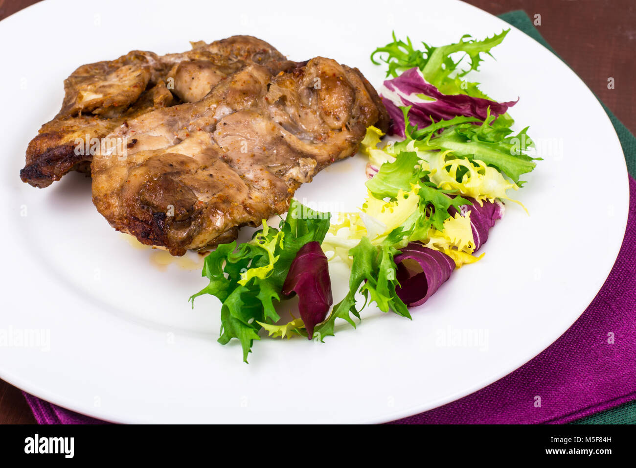 Concept of proteincarbohydrate nutrition. Chicken meat with lettuce