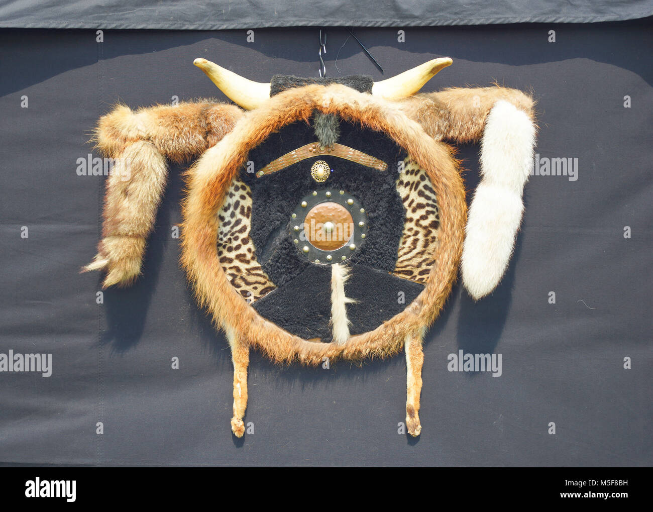 Indian dreamcatcher symbol is hung up in front of a black tent Stock Photo
