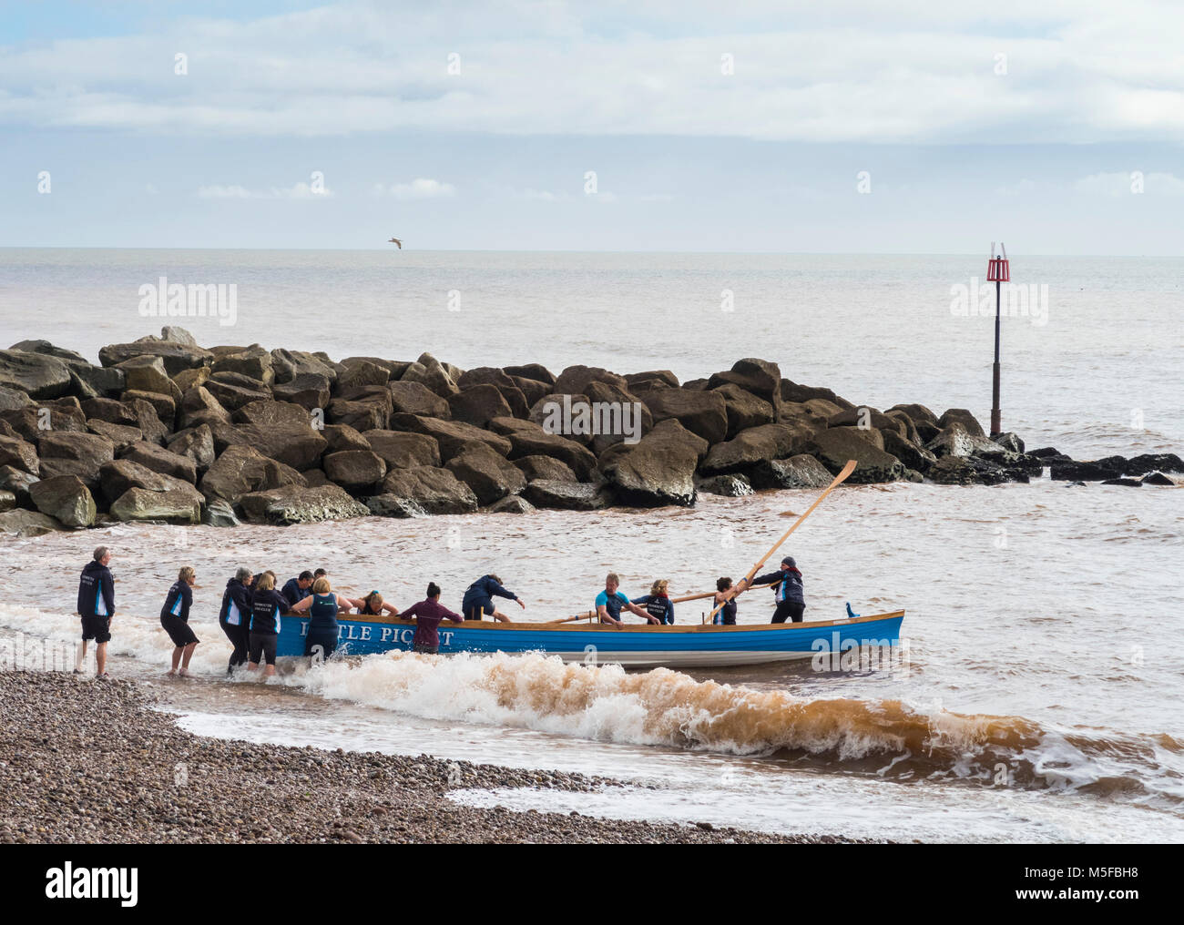 Launching a new Pilot Gig boat the 'Little Picket' at Sidmouth, Devon Stock Photo