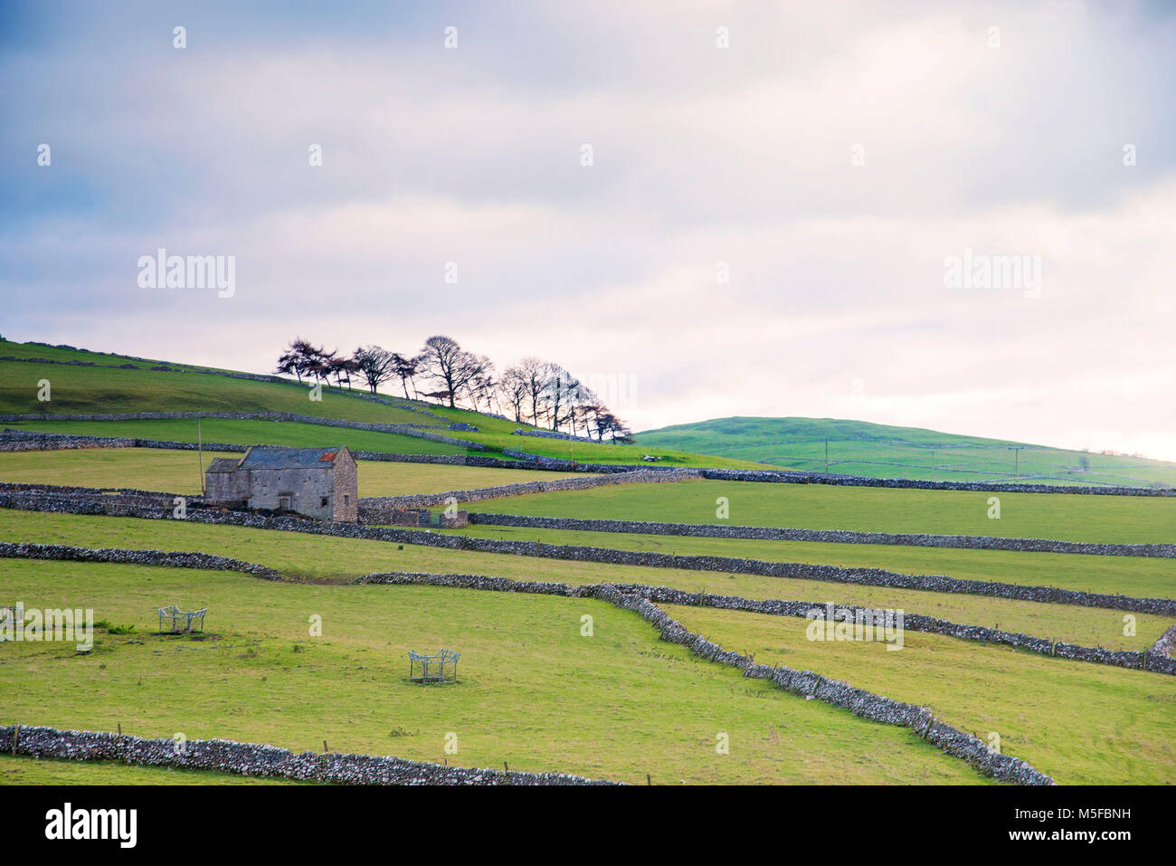 The Derbyshire peak district countryside showing an old barn and
