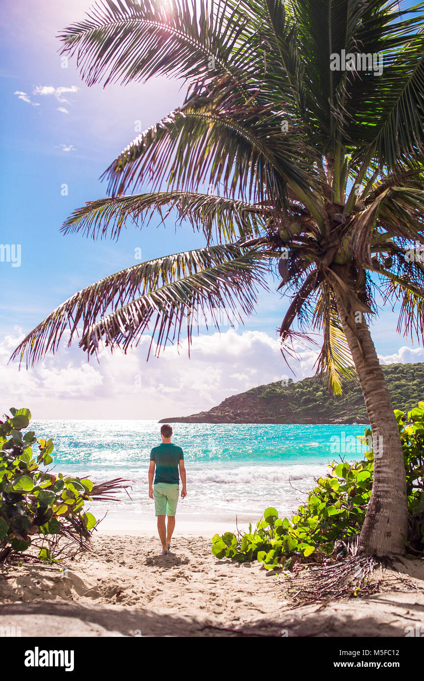 Young tourist man walking to the on caribbean island Stock Photo - Alamy
