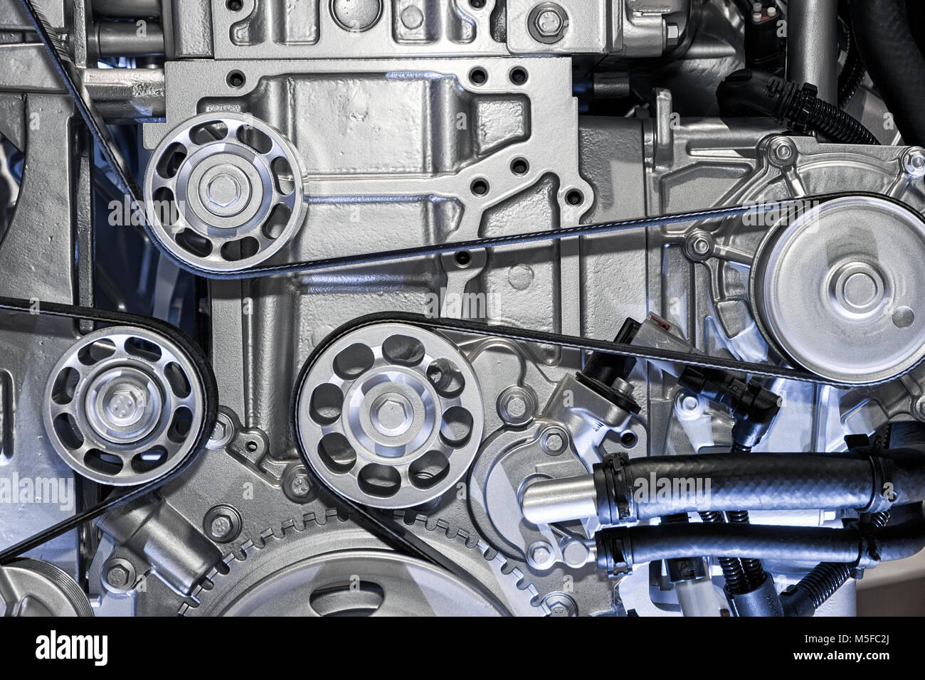 View on pulley and belts on a car engine Stock Photo Alamy