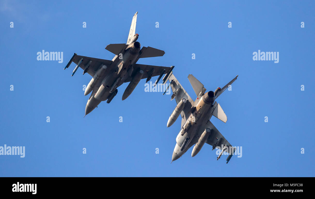 LEEUWARDEN, NETHERLANDS - MAR 28, 2017: NATO F-16 fighter jets in flight over Leeuwarden airbase during exercise Frisian Flag. Stock Photo