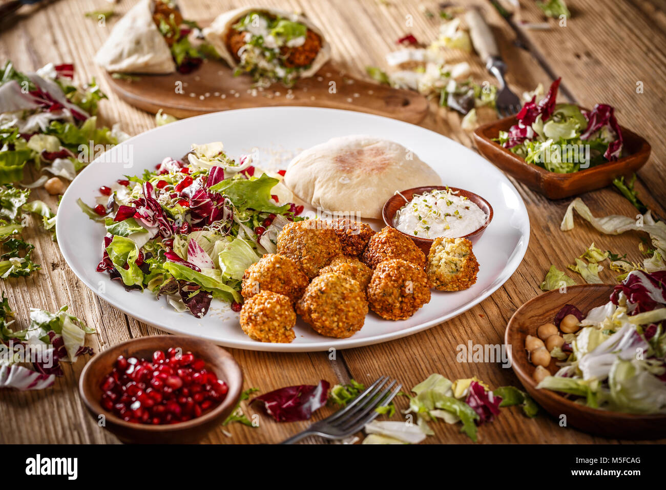 Vegetarian falafels and lettuce in white plate Stock Photo